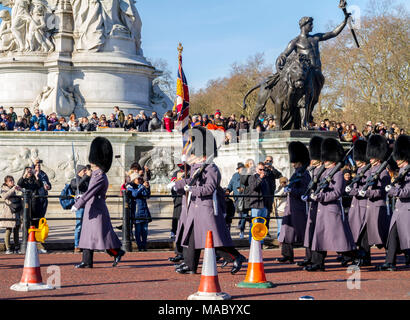 Crowds gathered watching the Queens Guard, Royal Guards in their Winter Uniforms, Changing of the Guards parade at Buckingham Palace, London UK Stock Photo