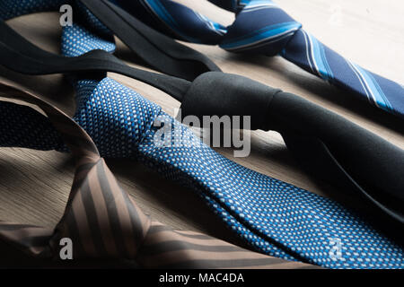 Silk neck ties on wooden background. Stock Photo