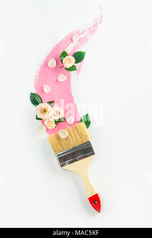 Premium Photo  New and used paintbrushes in a vase on a pink background  with copy space