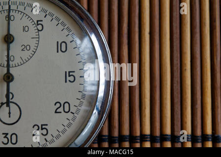 Vintage antiques Stopwatch, retro on wooden background, value measure time old clock arrow minute second accuracy timer record Stock Photo