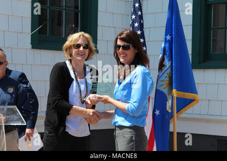 Vandenberg Air Force Base Recognized as 2015 Military Conservation Partner. Deputy Regional Director Alex Pitts, presenting Samantha Kaisersatt, NEPA Planner and Biologist/Vandenberg AFB, with an award for outstanding leadership.   The U.S. Fish and Wildlife Service recognized Vandenberg Air Force Base as the recipient of the prestigious Military Conservation Award during a ceremony held at the 30th Space Wing in  central California. Stock Photo