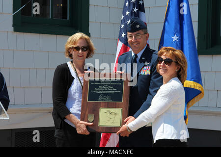 Vandenberg Air Force Base Recognized as 2015 Military Conservation Partner. Deputy Regional Director Alex Pitts, Colonel Keith Balts and Chief Beatrice Kephart, Asset Management Flight, with the installation plaque.   The U.S. Fish and Wildlife Service recognized Vandenberg Air Force Base as the recipient of the prestigious Military Conservation Award during a ceremony held at the 30th Space Wing in  central California. Stock Photo