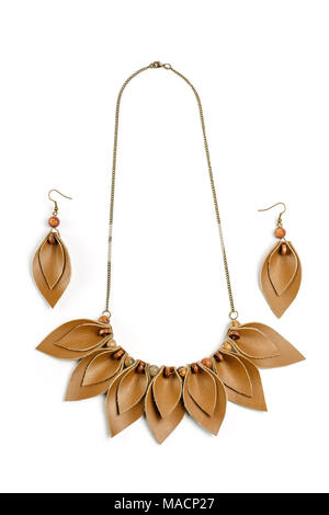 Original handicraft necklace and earrings in the form of petals made of brown leather on white background Stock Photo