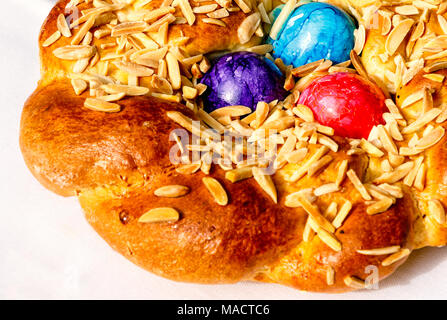 Homemade Easter traditional bread decorated with colorful eggs, festive bakery Stock Photo
