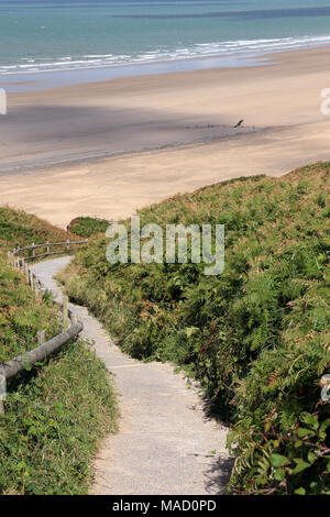 Path leading to Rhossili Beach, Gower Peninsula, Wales, UK, with the wreck of the Helvetia in the distance. Stock Photo