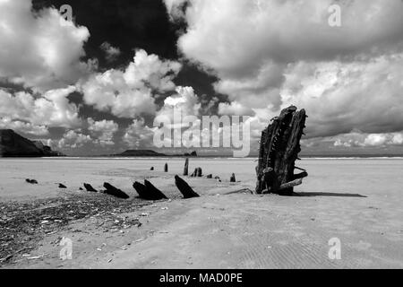 Monochrome image of the wreck of the Helvetia on Rhossili Beach, Gower Peninsula, Wales, UK. Stock Photo