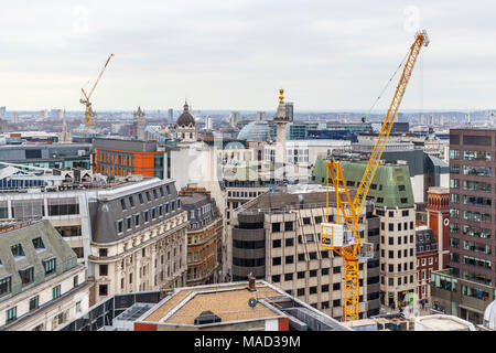 Rooftop view over the City of London with tower cranes, the nearer on the Whole Block Site in Abchurch Lane London EC4, the site of the new Bank Under Stock Photo