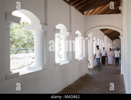 People  leaving Dambulla Cave Temple, Dambulla, Sri Lanka, Asia. Stock Photo