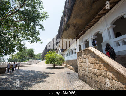 Tourists visiting Dambulla Cave Temple, Dambulla, Sri Lanka, Asia. Stock Photo