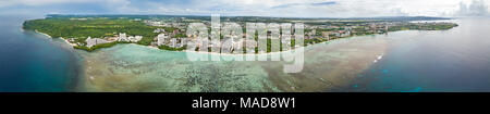 An aerial panorama of Tumon Bay with it’s hotels and beach, Guam, Micronesia, Mariana Islands, Pacific Ocean. Stock Photo