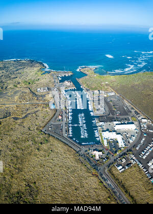 An aerial of Honokohau Small Boat Harbor, Kona's biggest harbor, with over 250 boat docks and several hundred more dry-docked boats, North Kona Distri Stock Photo