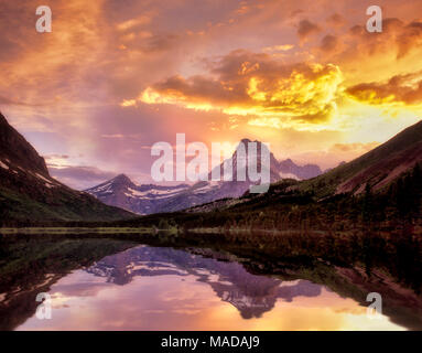 Sunset on Swiftcurrent Lake with Mount Wilbur. Glacier National Park, Montana. Stock Photo