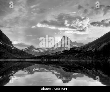 Sunset on Swiftcurrent Lake with Mount Wilbur. Glacier National Park, Montana. Stock Photo