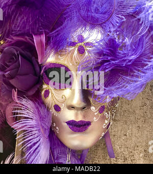 Masquerade Mask in Purple and Gold. Traditional Venetian Costume. Square image. Stock Photo