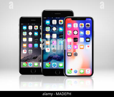 License available at MaximImages.com - Apple iPhone X on right, large screen smartphone, and iPhone 8, 8 plus, phablet in the middle Stock Photo