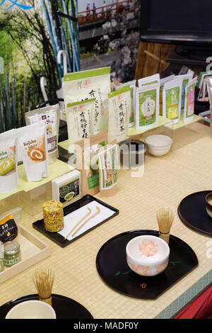 Organic Uji Matcha tea of different grades and a bowl cup with a whisk for matcha sampling ceremony in a store in Uji, Kyoto Prefecture, Japan