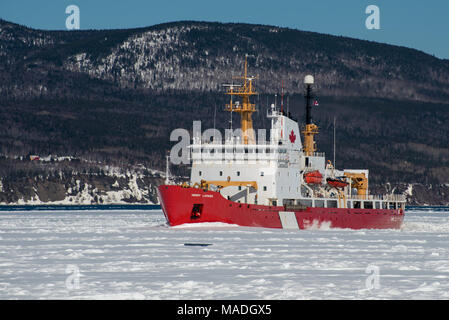 Canadian Coast Guard icebreaker Henry Larsen at work in the Gaspe Bay, Gaspe, Quebec, Canada on March 30, 2018 Stock Photo