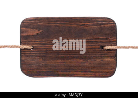 Old wooden signboard of dark wood, hanging on ropes. Isolated on white background Stock Photo