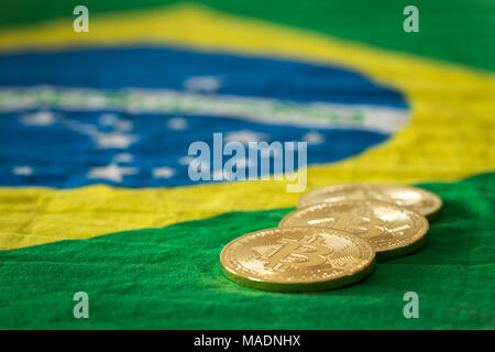 bitcoins on the background of the Brazilian flag Stock Photo