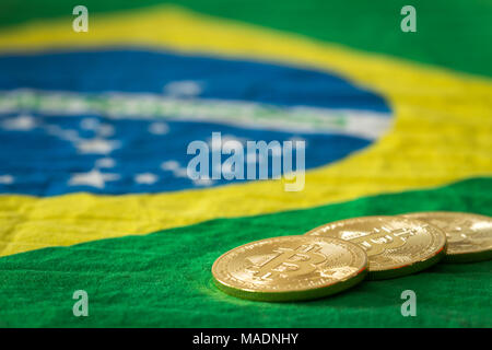 bitcoins on the background of the Brazilian flag Stock Photo
