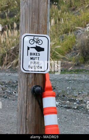 Push button road crossing sign for cyclists. Stock Photo