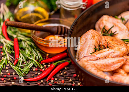 Chickens wings covered in honey, vegetables Stock Photo