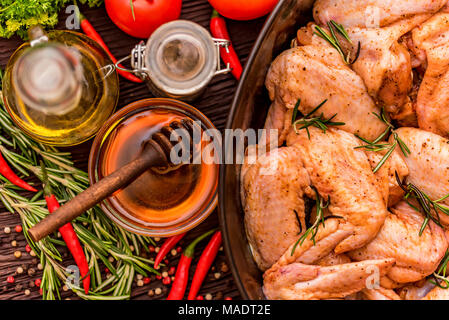 Chickens wings covered in honey, vegetables Stock Photo
