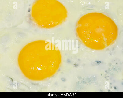 Omelette of three eggs in the background Stock Photo