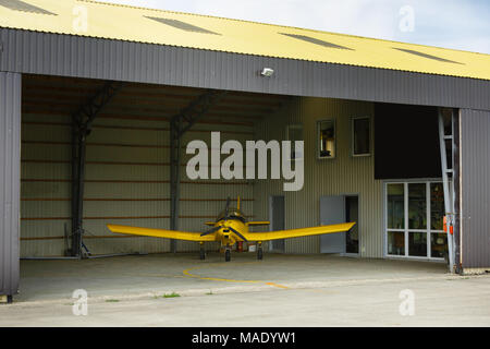 small plane standing in shed Stock Photo