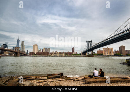 Manhattan bridge, Brooklyn bridge and the lower Manhattan skyline seen from Brooklyn Bridge Park, a waterfront park along the East River in New York. Stock Photo