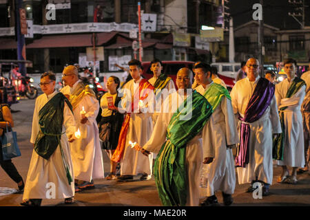 March 29, 2018 - Manila, NCR, Philippines - A representation of the 12 Disciples of Christ seen during the parade..Every year of in March, Christians all over the world commemorate the suffering and death of Jesus Christ on the cross. In the Philippines, Holy Week or â€œSemana Santaâ€ has been celebrated by having different rituals and practices such as â€œVisita Iglesiaâ€ or visiting several churches, â€œPenetensyaâ€ or Penitence of re enacting the hardship of Jesus Christ, â€œPabasaâ€ or graphical reading of the word of God and â€œParadaâ€ or parade of the saints, disciple and journey o Stock Photo