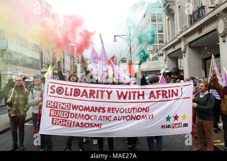London, UK, 31 Mar 2018. Anarchists let off Smoke Bombs during the March Credit: Alex Cavendish/Alamy Live News Stock Photo