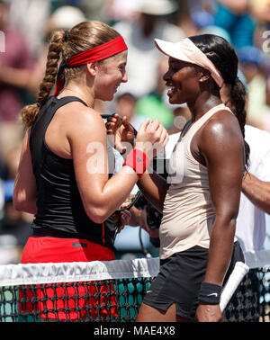 Key Biscayne, Florida, USA. 31st Mar, 2018. Jelena Ostapenko (left) of Latvia and Sloane Stephens(right) of the United States meet at the net after Stephens wins the women's championship final at the 2018 Miami Open presented by Itau professional tennis tournament, played at the Crandon Park Tennis Center in Key Biscayne, Florida, USA. Stephens won 7-6(5), 6-1. Mario Houben/CSM/Alamy Live News Stock Photo