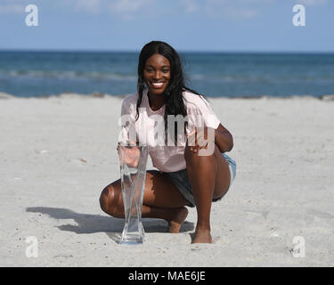 Key Biscayne, FL, USA. 31st Mar, 2018. Sloane Stephens poses with the championship trophy on Crandon Beach after defeating Jelena Ostapenko during the Womens Final the Miami Open at Crandon Park Tennis Center on March 31, 2018 in Key Biscayne, Florida. Credit: Mpi04/Media Punch/Alamy Live News Stock Photo