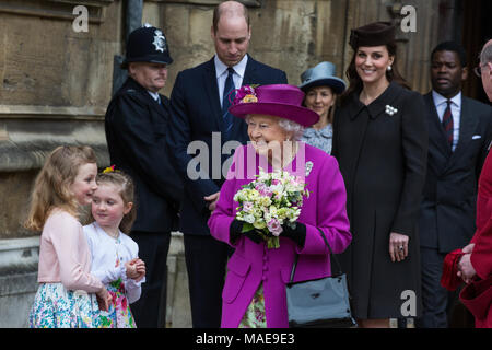 Windsor, UK. 1st April, 2018. The Queen leaves the Easter Sunday service at St George's Chapel in Windsor Castle after being presented with traditional posies of flowers by Amelia Vivian and Madeleine Carleston, both aged 6. Credit: Mark Kerrison/Alamy Live News Stock Photo
