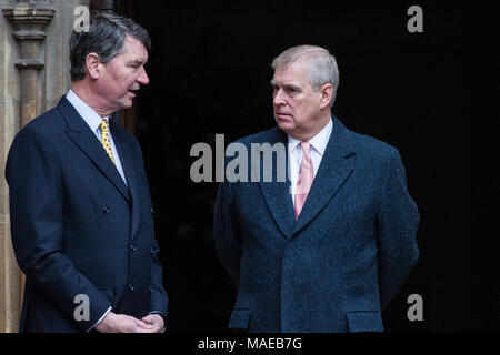 Windsor, UK. 1sat April, 2018. Prince Andrew, the Duke of York, speaks to Vice Admiral Sir Timothy Laurence outside St George's Chapel in Windsor Castle before the Easter Sunday service. Stock Photo