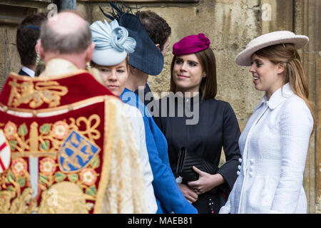 Windsor, UK. 1st April, 2018. Members of the Royal Family including Princesses Eugenie and Beatrice await the arrival of the Queen outside St George's Chapel in Windsor Castle before the Easter Sunday service. Credit: Mark Kerrison/Alamy Live News Stock Photo