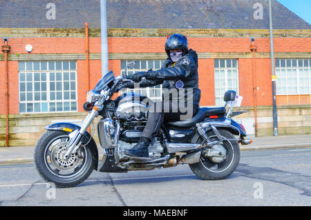 Glasgow, Scotland, UK. 1st April, 2018. Over 1000 bikers, many wearing a colourful costume, from all over Scotland meet in Glasgow for the annual Easter Egg Run from Glasgow Green to The Royal Hospital For Children to raise funds for Glasgow Children's Hospital Charity. Pictured biker riding a Triumph motorcycle. Credit: Skully/Alamy Live News Stock Photo