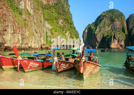 Longtail boats anchored at Maya Bay on Phi Phi Leh Island, Krabi Province, Thailand. It is part of Mu Ko Phi Phi National Park. Stock Photo