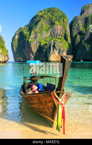Longtail boat anchored at Maya Bay on Phi Phi Leh Island, Krabi Province, Thailand. It is part of Mu Ko Phi Phi National Park. Stock Photo