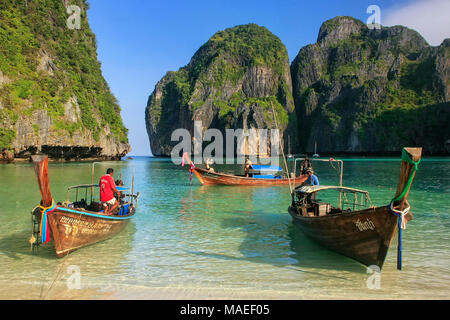 Longtail boats anchored at Maya Bay on Phi Phi Leh Island, Krabi Province, Thailand. It is part of Mu Ko Phi Phi National Park. Stock Photo