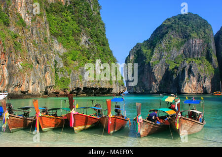 Longtail boats anchored at Maya Bay on Phi Phi Leh Island, Krabi Province, Thailand. It is part of Mu Ko Phi Phi National Park. Stock Photo