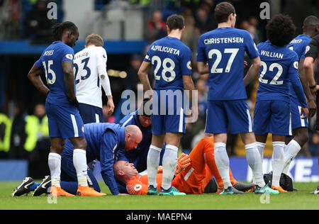 Chelsea goalkeeper Willy Caballero reacts to an injury during the Premier League match at Stamford Bridge, London. Stock Photo