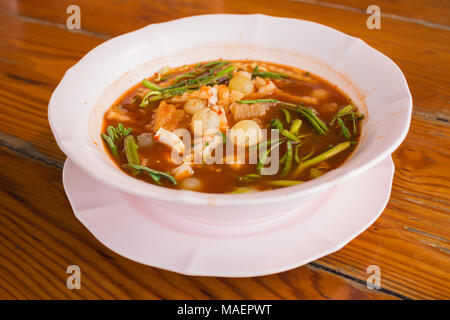 Thai soup, Egg fish And Vegetable in orange Spicy tamarind and spice Soup (kaeng som Kai-pa) Stock Photo