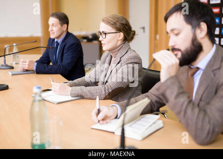 Business People Participating in Press Conference Stock Photo
