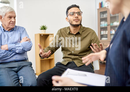 Productive Problem Discussion at Group Therapy Session Stock Photo