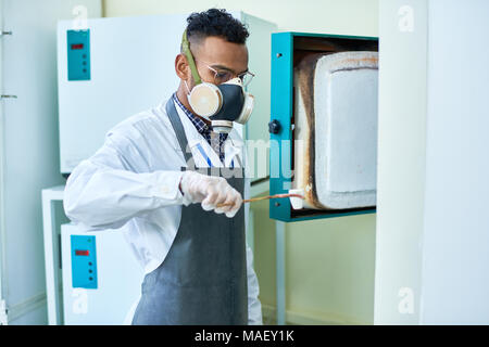 Scientist holding dangerous experiment Stock Photo