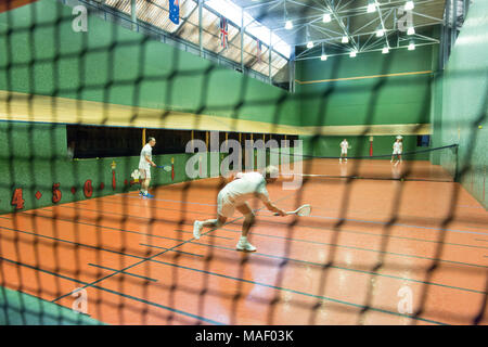 Real Tennis court with players in action. Stock Photo