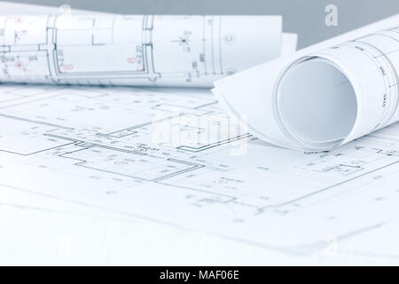 architectural and engineering project plans and blueprint rolls on architect workplace Stock Photo