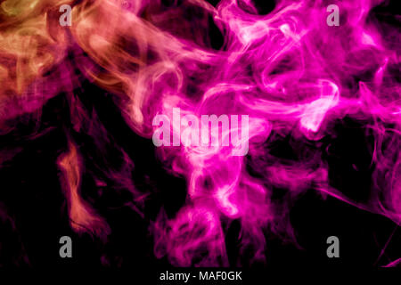 Pink and yellow smoke on black background Stock Photo